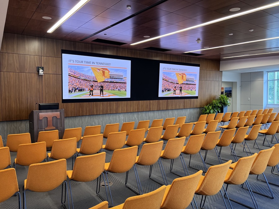 A modern conference room with a display.