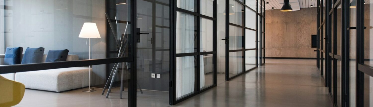 hallway between glass-panel doors